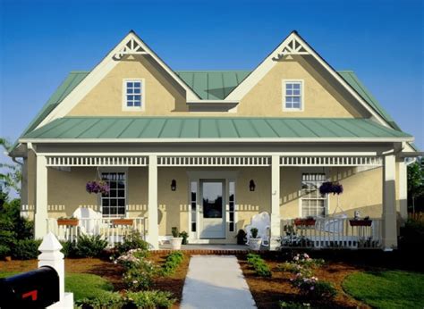 yellow houses with green metal roofs|yellow house with charcoal roof.